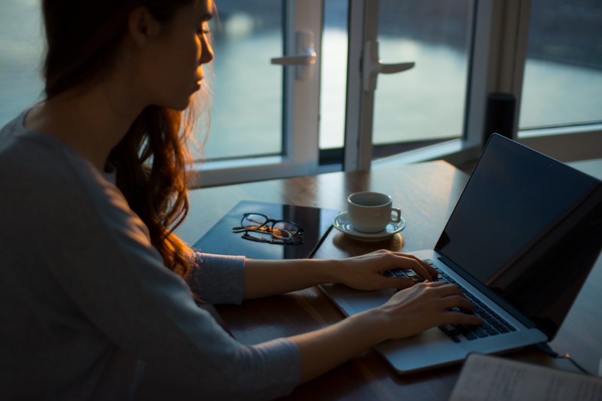 Woman by computer. Thought Catalog, Unsplash.